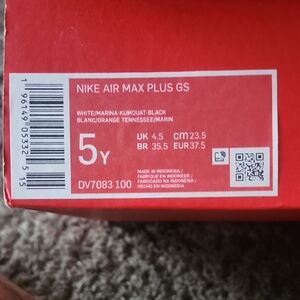 Nike Air Max Plus GS in White, Orange, and Black